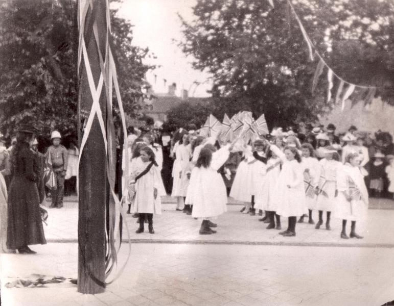 Maypole dancing Coronation Edward VII.jpg - Maypole girls performing a Flag Drill on the Concrete, on June 26th 1902, as part of the celebrations for the Coronation of  Edward  VII (Due to illness the actual date of the coronation was delayed till Aug 9th 1902)